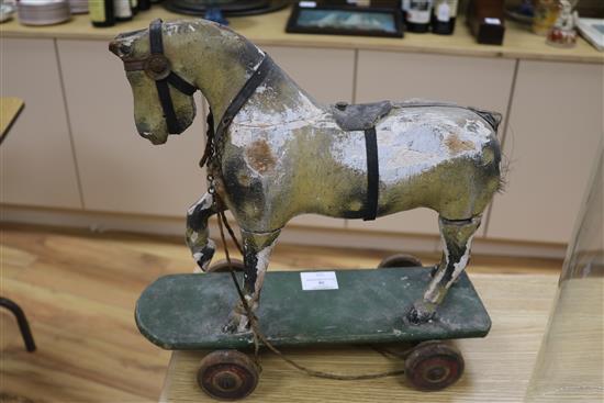 A Victorian painted carved wood pull-along horse